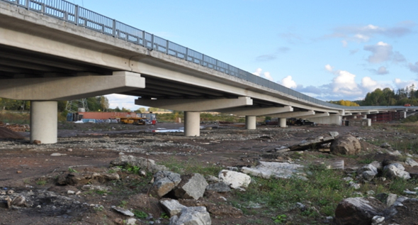 Выполнение приемочных испытаний автодорожного моста через реку Сторожевая.
